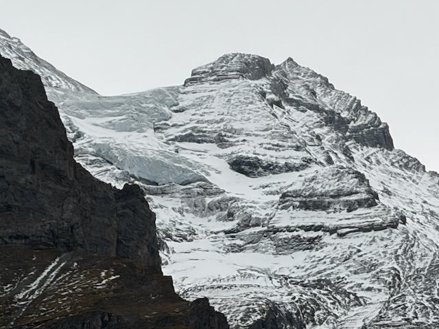 Close view of snow-covered mountain rock faces