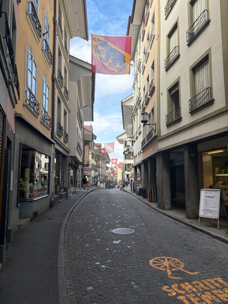 Flags along a street in Thun
