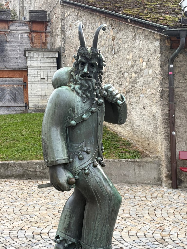 Bronze figure in a castle courtyard